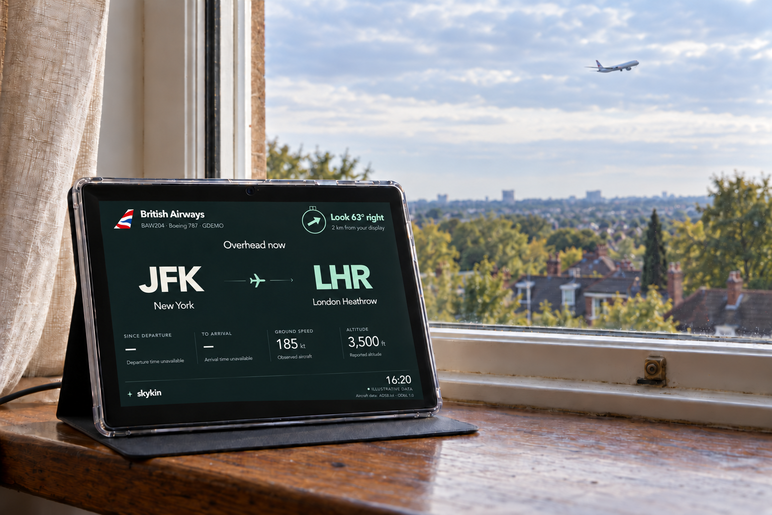 Skykin on a windowsill displays a nearby aircraft’s flight, with a visible direction arrow towards the aircraft outside.